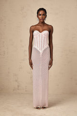 Pink maxi dress with rhinestone embellishments and semi sheer fabric featuring a long flowing design