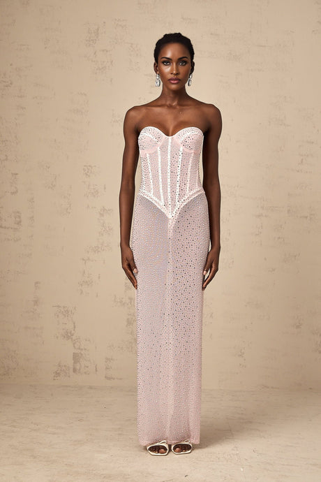 Pink maxi dress with rhinestone embellishments and semi sheer fabric featuring a long flowing design