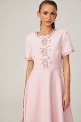 Pink midi dress with crystal accents and bow detail featuring Cassiopeia design