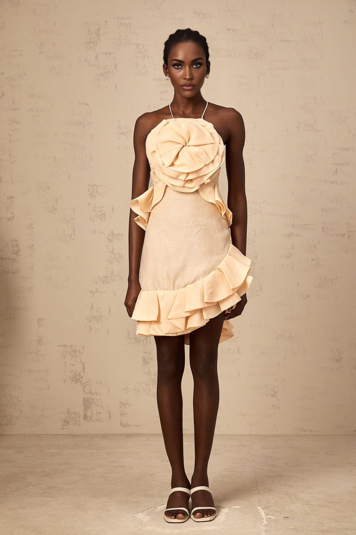 Pink mini dress with 3d petal ruffles and a short hemline called Ginevra