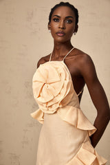 Pink mini dress with 3D petal ruffles and a short hemline featuring a floral inspired design