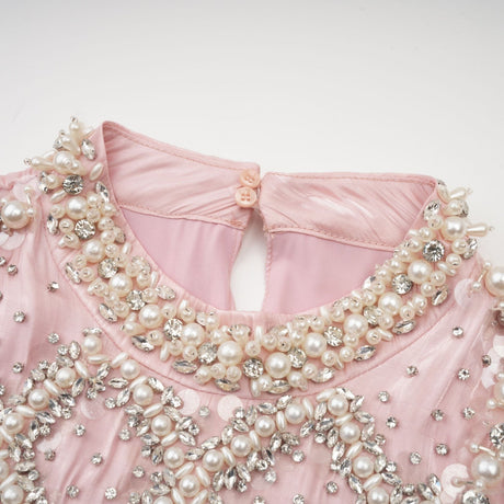 Pink mini dress with pleated skirt and embellished details named Helena
