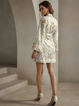 This charming dress features a delicate pastel floral print on a light fabric, perfect for sunny days. With a flattering.