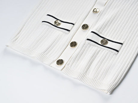 Raven Top – Fitted Ribbed Knit – Collared Design – Gold Button Accents – Decorative Pockets – Tailored Silhouette – Stretch Fabric