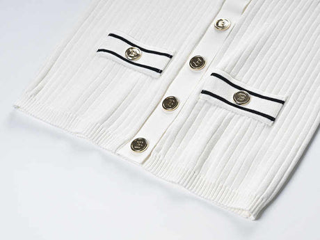 Raven Top – Fitted Ribbed Knit – Collared Design – Gold Button Accents – Decorative Pockets – Tailored Silhouette – Stretch Fabric