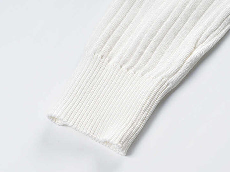 Raven Top – Fitted Ribbed Knit – Collared Design – Gold Button Accents – Decorative Pockets – Tailored Silhouette – Stretch Fabric