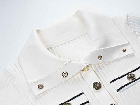 Raven Top – Fitted Ribbed Knit – Collared Design – Gold Button Accents – Decorative Pockets – Tailored Silhouette – Stretch Fabric