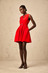 Red mini dress with split neckline and cinched waist