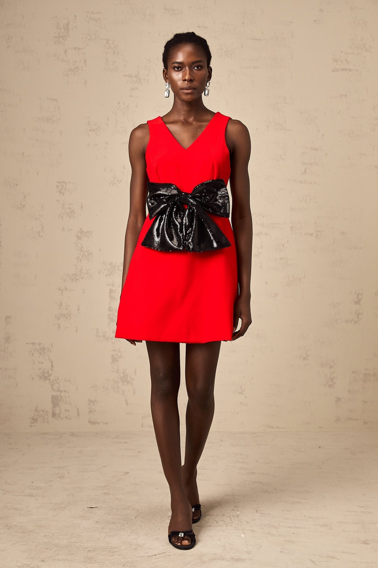 Red mini dress with Vneck and sequin bow detail