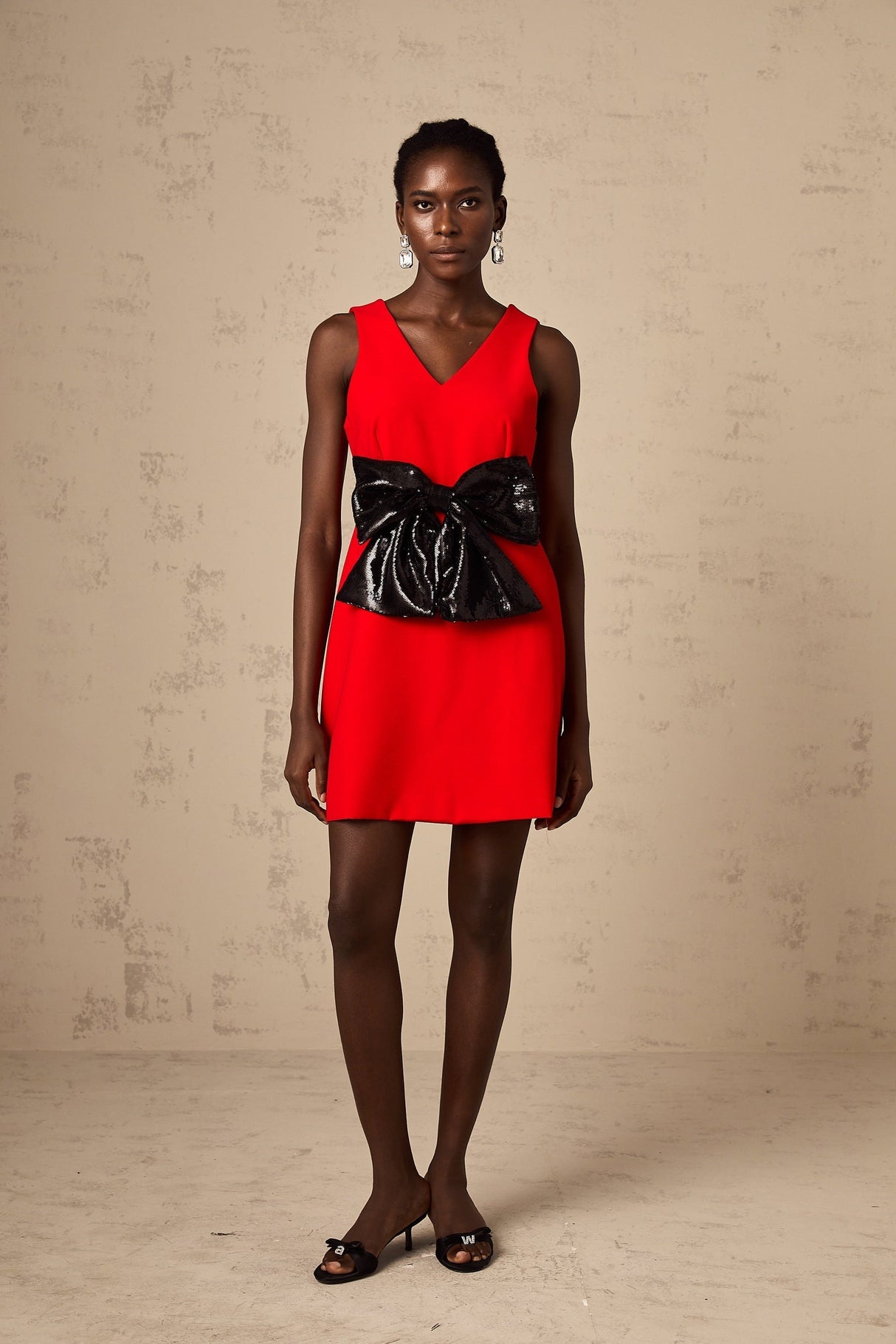 Red mini dress with Vneck and sequin bow detail