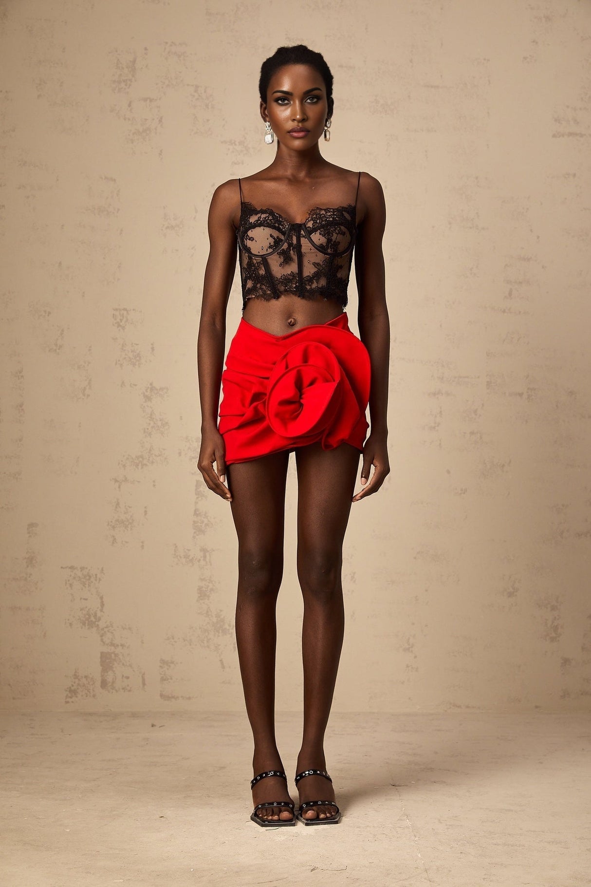 Red mini skirt with floral applique details and boned structure named Anne