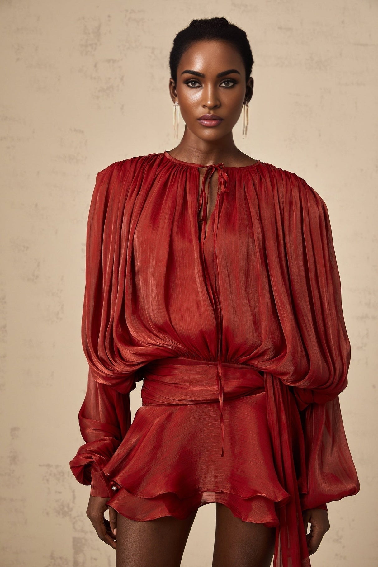 Red pleated mini dress with ruffles and full skirt named Eugenie
