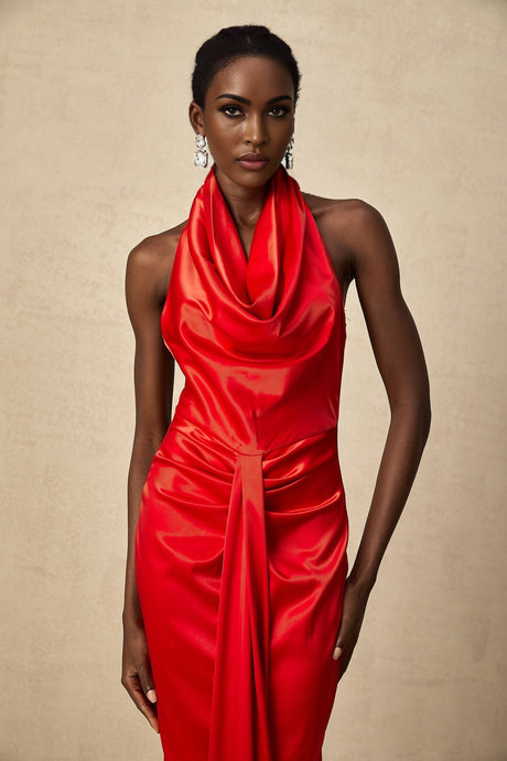Red satin maxi dress with halter neckline and draped design