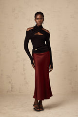 Red satin skirt with flared silhouette shown on white background