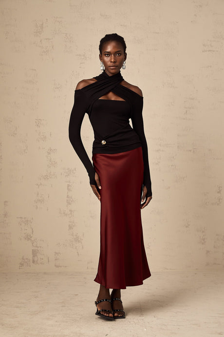 Red satin skirt with flared silhouette shown on white background