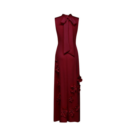 Red sleeveless maxi dress with bow tie and faux flower embellishments