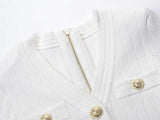 Roselia Top – Fitted Ribbed Knit – Short Sleeves – Gold Button Detail – Front Pockets – Tailored Silhouette – Textured Fabric