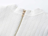 Roselia Top – Fitted Ribbed Knit – Short Sleeves – Gold Button Detail – Front Pockets – Tailored Silhouette – Textured Fabric