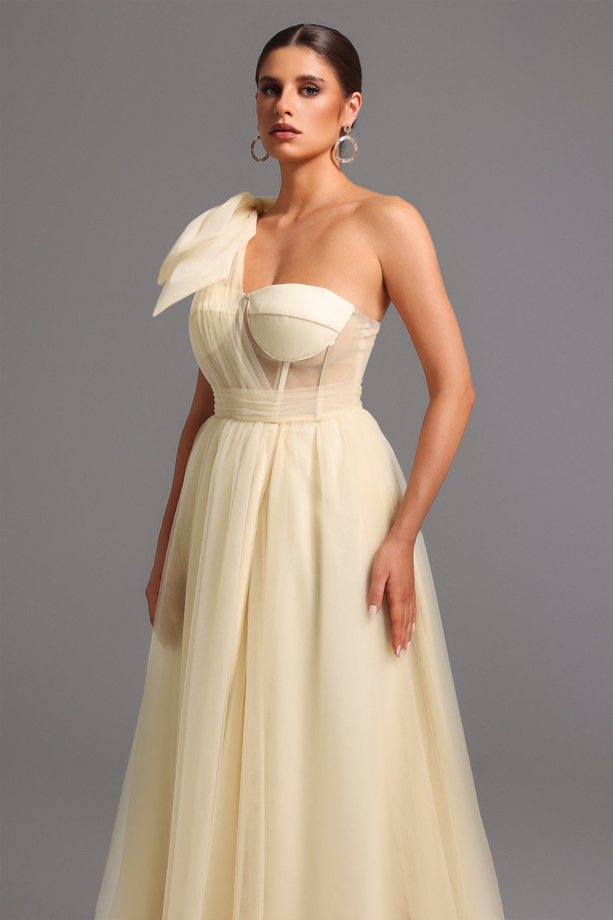 Santa beige one shoulder maxi dress with bow detail and thigh-high slit