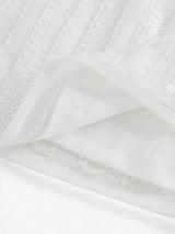 This elegant white dress features shimmering sequins and a flowing design that exudes sophistication. The lightweight fabric.