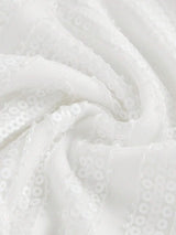 This elegant white dress features a sparkling sequined fabric that catches the light beautifully, giving it a stunningly.