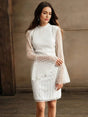 This elegant white dress features a stylish fit-and-flare silhouette with intricate geometric patterns etched in a.