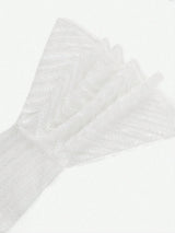 Delicate and enchanting, this white dress features shimmering sequins that catch the light beautifully, creating a.