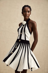 Sleeveless knitted mini dress in contrasting colors with the name Celeste