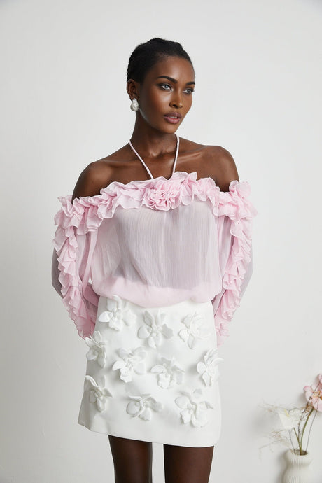 Sleeveless pink semi sheer top with a straight neckline