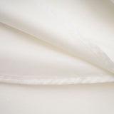 Sleeveless white maxi dress with bow and artificial flower embellishment named Magali