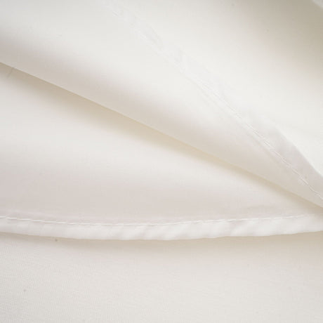 Sleeveless white maxi dress with bow and artificial flower embellishment named Magali