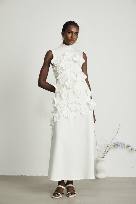 Sleeveless white maxi dress with bow and decorative artificial flowers named Magali