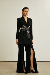Stylish black blazer with bowknot detail and cutout design featuring long sleeves and a fitted silhouette