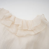 Tiered mini dress in neutral tones with floral applique detailing named Zephyrine