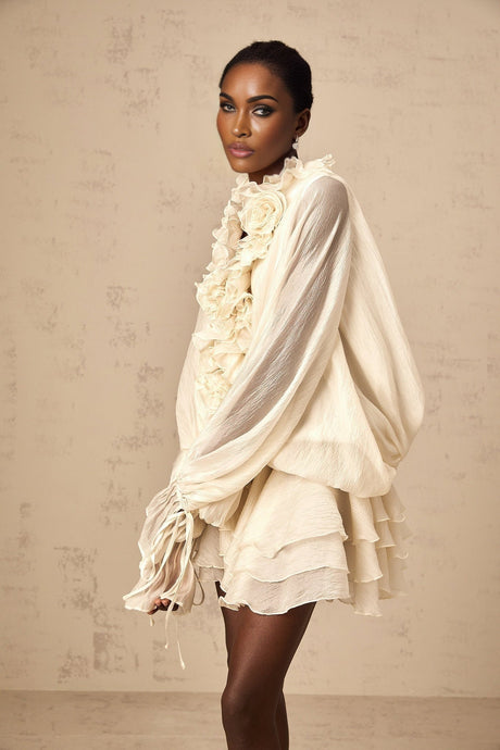Tiered mini dress in neutral tones with floral applique details named Zephyrine