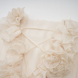 Tiered mini dress in neutral tones with floral applique details named Zephyrine