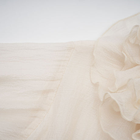 Tiered mini dress with floral applique details in neutral tones