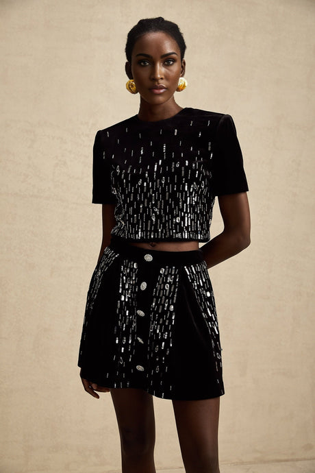 Two piece black velvet outfit with embellishments featuring a top and skirt set called Isabeau