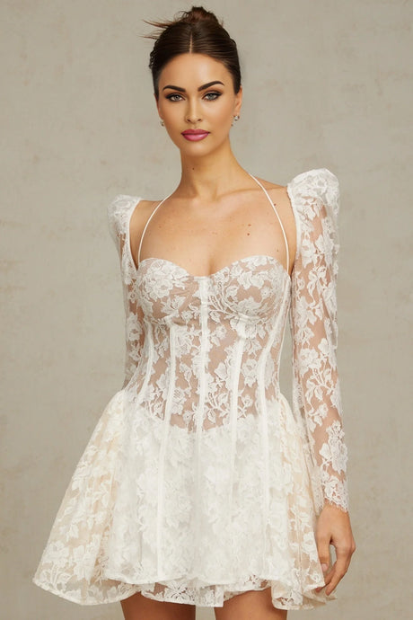Vivienne white mini dress with floral lace detailing and corset style bodice on a plain background