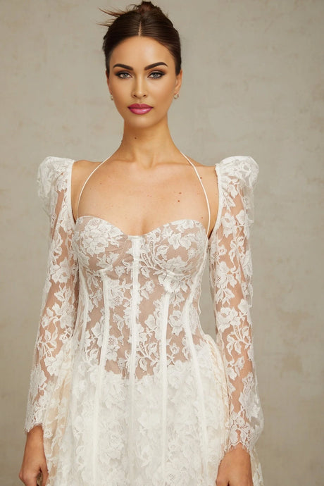 Vivienne white mini dress with floral lace detailing and corset style bodice on a plain background