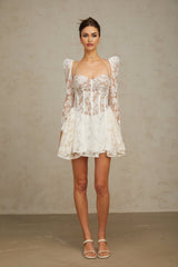 Vivienne white mini dress with floral lace pattern and corset bodice on a mannequin