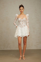 Vivienne white mini dress with floral lace pattern and corset style bodice on a mannequin