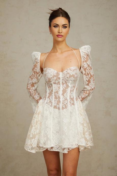 Vivienne white mini dress with floral lace pattern and corset style bodice on a mannequin
