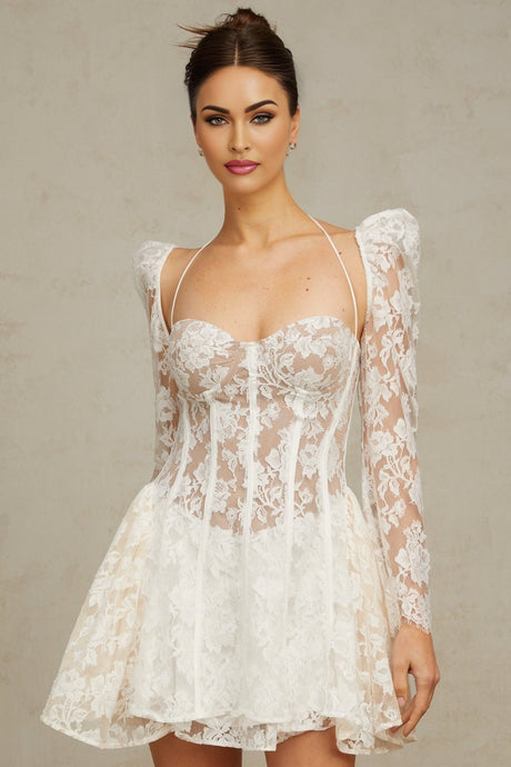 Vivienne white mini dress with floral lace pattern and corset style bodice on a plain background