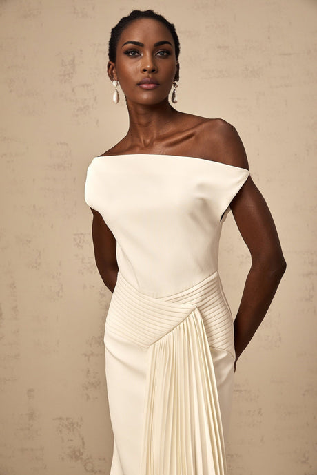 White asymmetric draped midi dress with a flowy design and uneven hemline