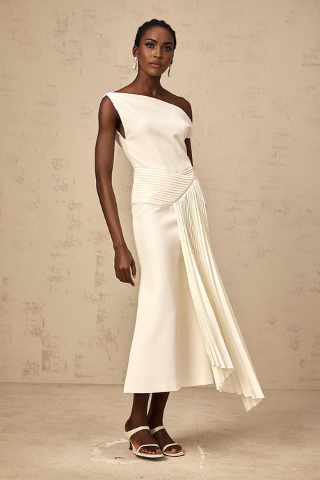 White asymmetric draped midi dress with side slit and flowing fabric