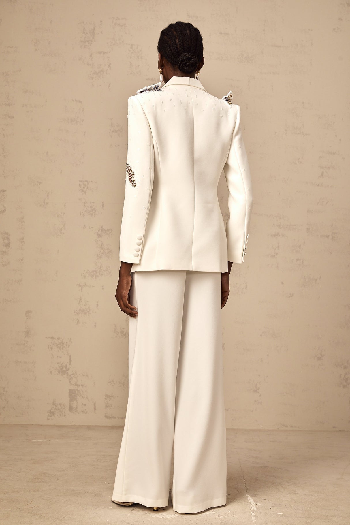 White blazer and trousers set with butterfly applique embellishments
