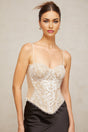 White bustier top with floral lace panels and slim straps