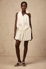 White halterneck top with floral applique details named Maeva