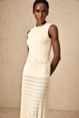 White knitted maxi dress with faux pearl embellishments by Donatienne